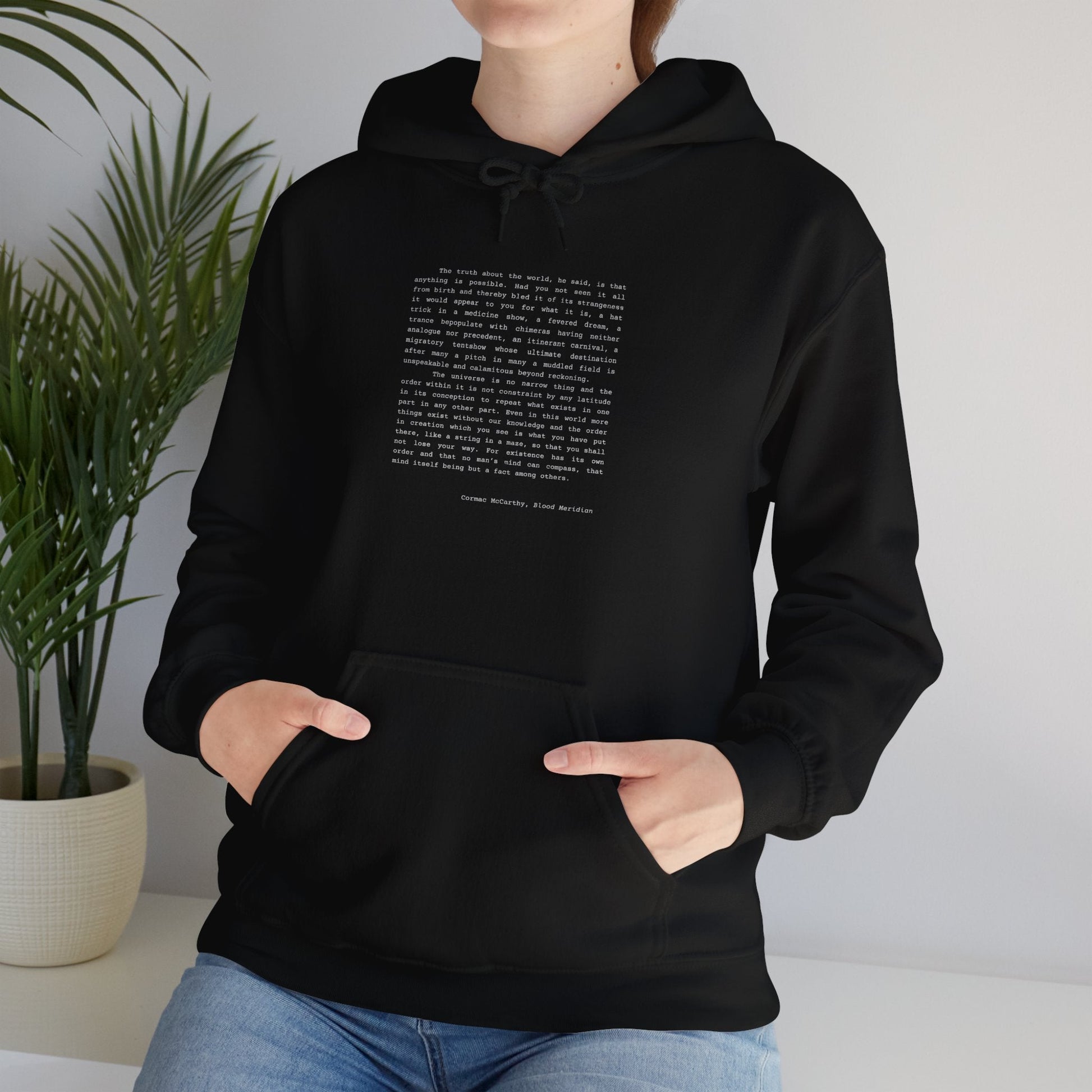 Black hoodie featuring a quote from Cormac McCarthy's "Blood Meridian".