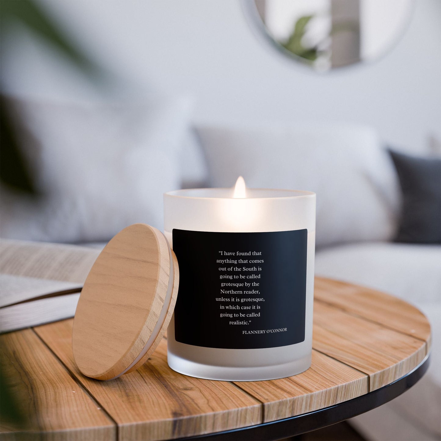 Flannery O'Connor Quote Candle in frosted glass with maple lid, featuring coconut soy wax and wooden wick.